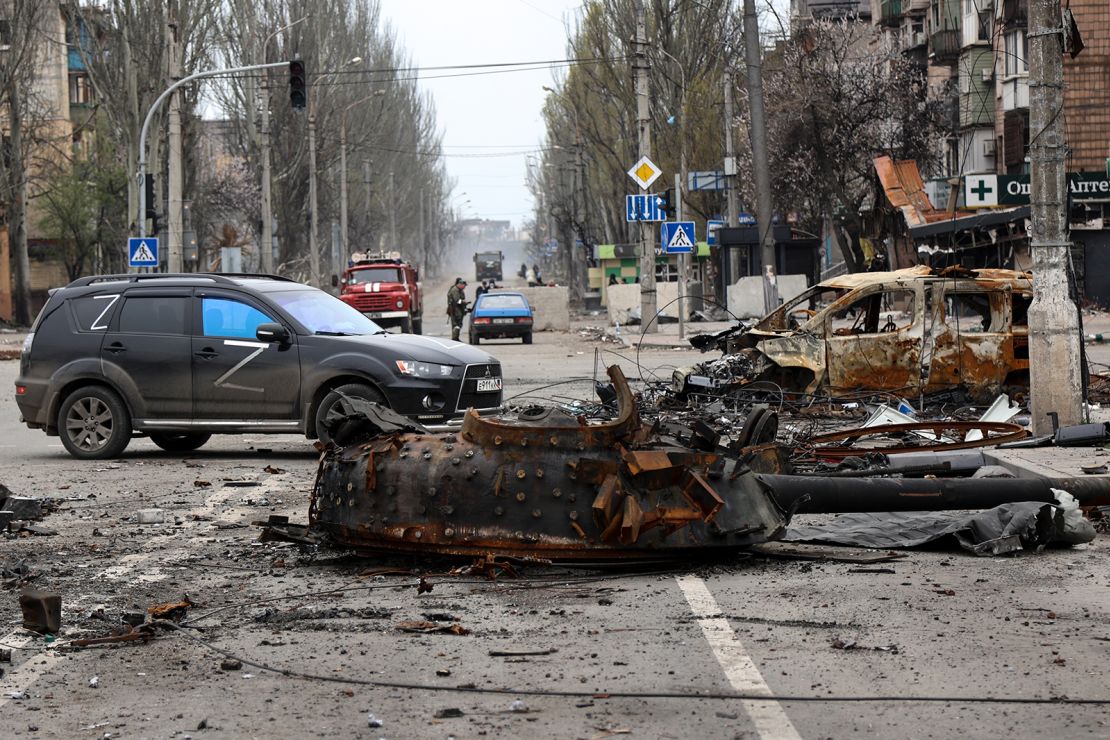 Part of a destroyed tank and a burned vehicle are pictured in an area controlled by Russian-backed separatist forces in Mariupol on April 23.