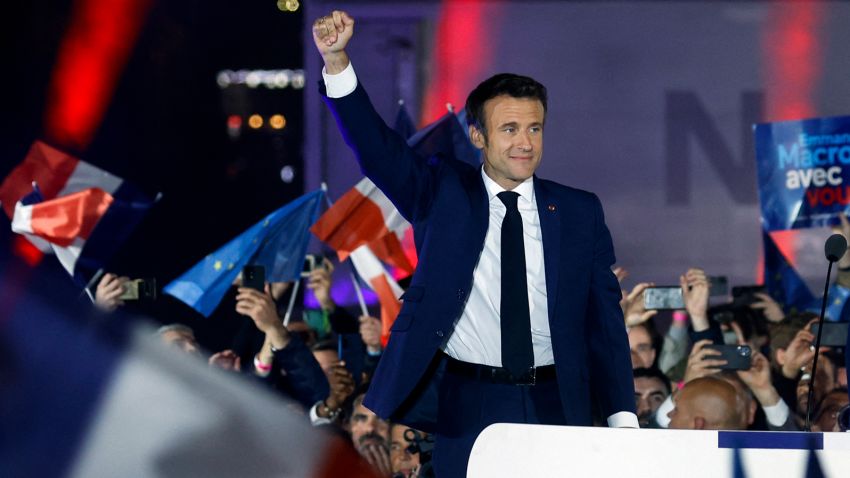 French President Emmanuel Macron gestures as he arrives to deliver a speech after being re-elected as president, following the results in the second round of the 2022 French presidential election, during his victory rally at the Champs de Mars in Paris, France, April 24.