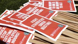 Picket signs are left for people to grab during the "Fight Starbucks' Union Busting" rally and march in Seattle, Washington on April 23, 2022. (Photo by Jason Redmond / AFP) (Photo by JASON REDMOND/AFP via Getty Images)