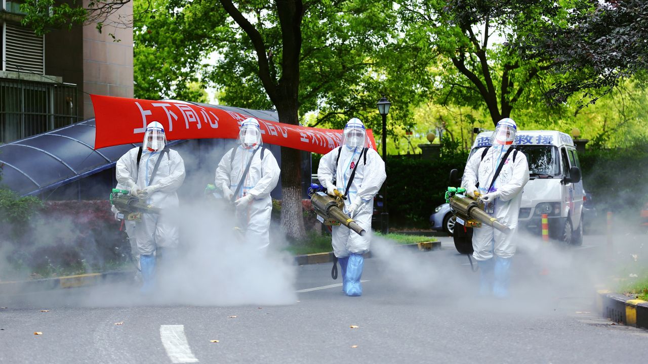 Workers disinfect a residential community during the Covid-19 lockdown in Shanghai.
