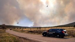 San Miguel County Sheriff's Officers patrol N.M. 94 near Penasco Blanco, N.M. as the Calf Fire burns near by Friday, April 22, 2022