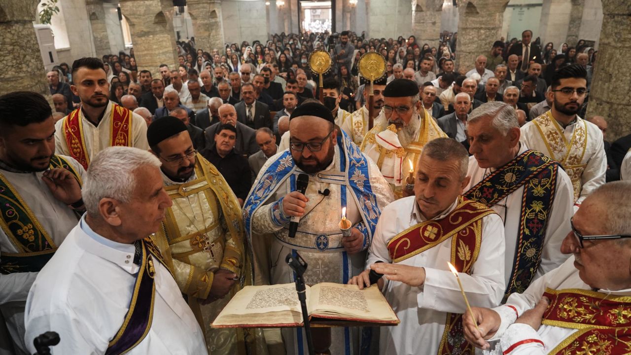 Priests lead the Easter Mass of Syriac Orthodox Christians on Sunday at Mart Shmoni Church in Bartella, east of Mosul, northern Iraq. 