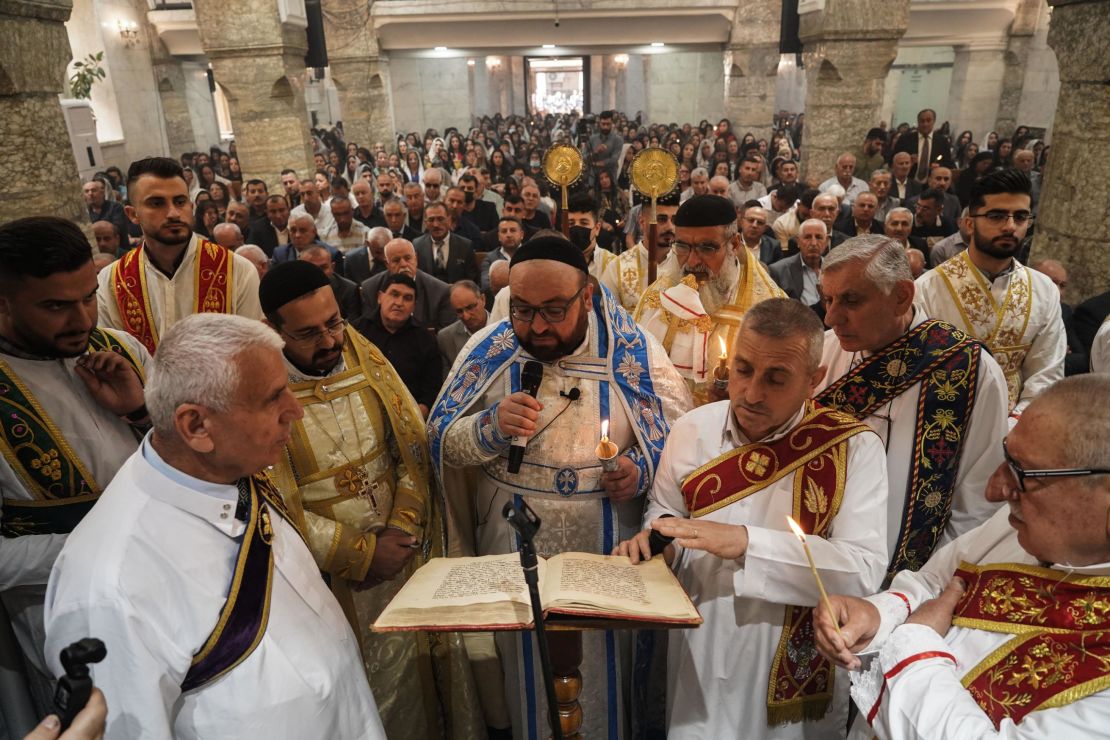 Priests lead the Easter Mass of Syriac Orthodox Christians on Sunday at Mart Shmoni Church in Bartella, east of Mosul, northern Iraq. 