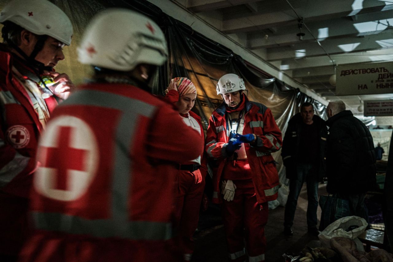 Members of the Ukrainian Red Cross talk before moving an elderly woman to an ambulance in a bunker under a factory in Severodonetsk, Ukraine, on April 22.  Zelensky says Russia waging war so Putin can stay in power &#8216;until the end of his life&#8217; 220425090324 03 ukraine gallery update 042522