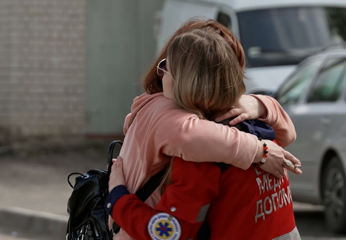 Rudkovskaya hugs her mother at the start of her 24-hour shift. 