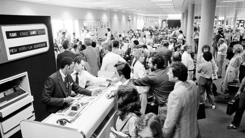 Passengers wait in the boarding area of one of the new airport concourses on Monday August 3, 1981, after air traffic controllers went on strike.