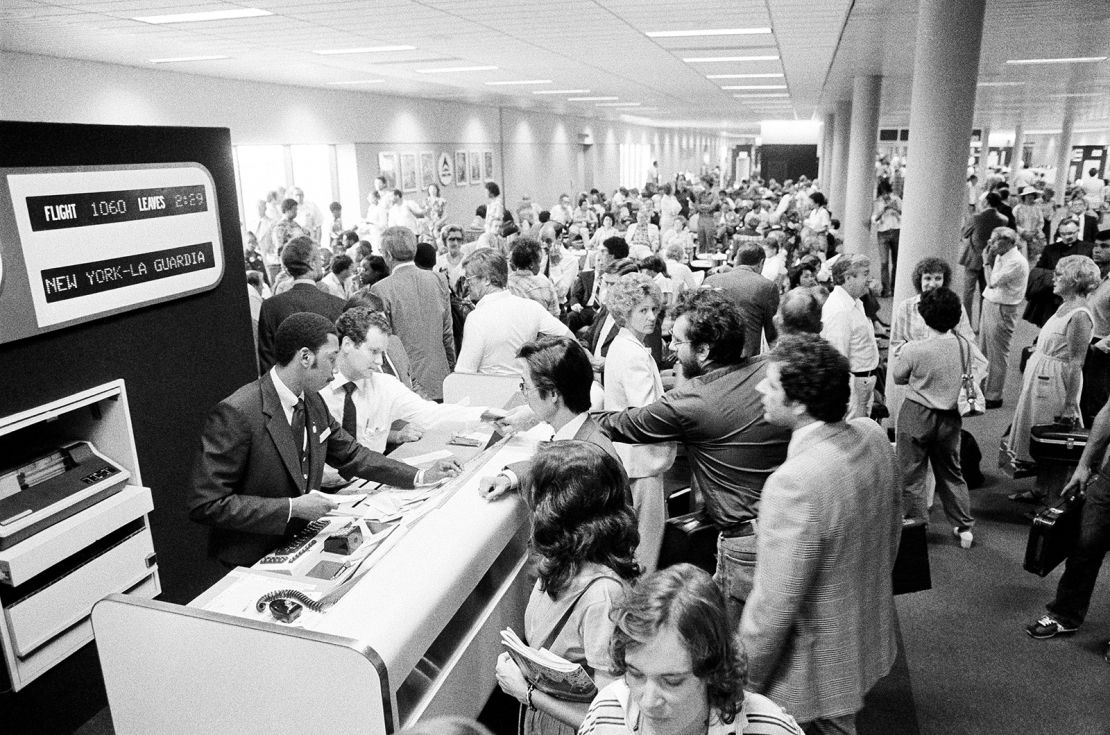Passengers wait in the boarding area of one of the new airport concourses on Monday August 3, 1981, after air traffic controllers went on strike.