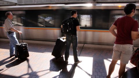 Passengers prepare to board a MARTA subway train at the airport in 2010. Direct mass transit from city centers to airports can also boost an airport's numbers.