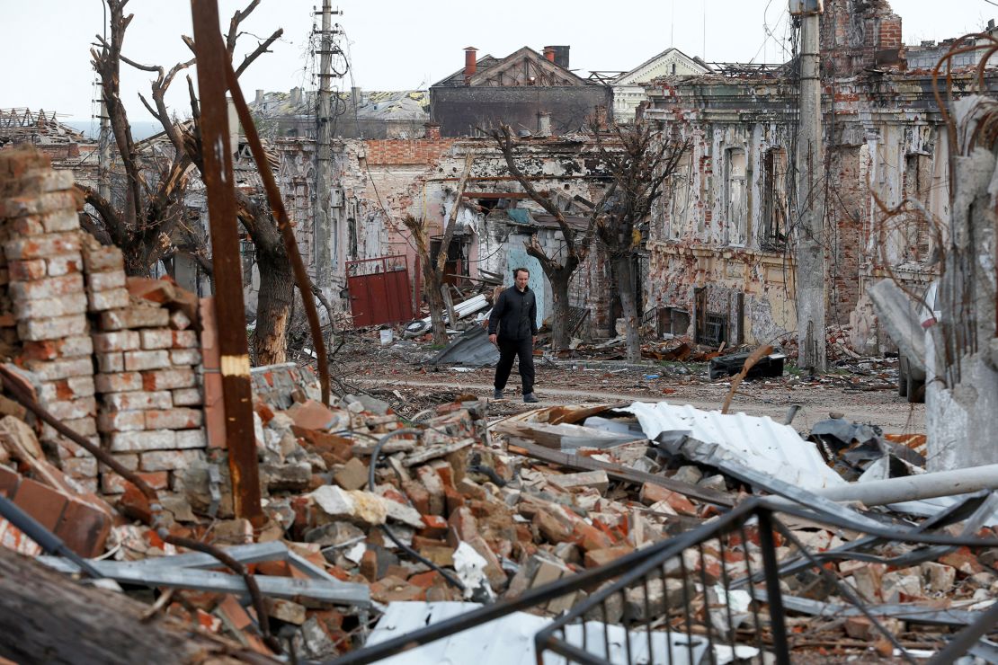 A man walks among the debris of the damaged southern port city of Mariupol, on April 22.