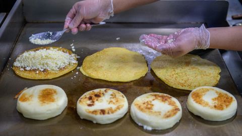 A cook prepares arepas in the kitchen of the Arepa Lady restaurant in the Queens borough of New York City on January 27.