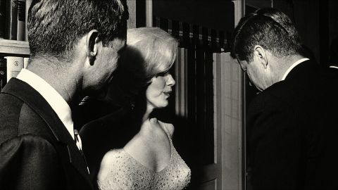 Marilyn Monroe with Robert Kennedy (left) and John Kennedy on the night of the latter's 1962 birthday celebration.