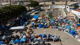 Aerial view of a migrants camp where asylum seekers wait for US authorities to allow them to start their migration process outside El Chaparral crossing port in Tijuana, Baja California state, Mexico on March 17, 2021. President Biden's pledge of a more humane approach has sparked a new rush to the border, threatening to become a huge political liability. Republicans are accusing him of opening the country's doors to illegal border-crossers and sparking a "crisis" on the US-Mexico frontier, while migrants out of Migrant Protection Protocols (MPP) program are stranded along the US-Mexico border without knowing when or how they will be able to start their migratory process with US authorities. 
