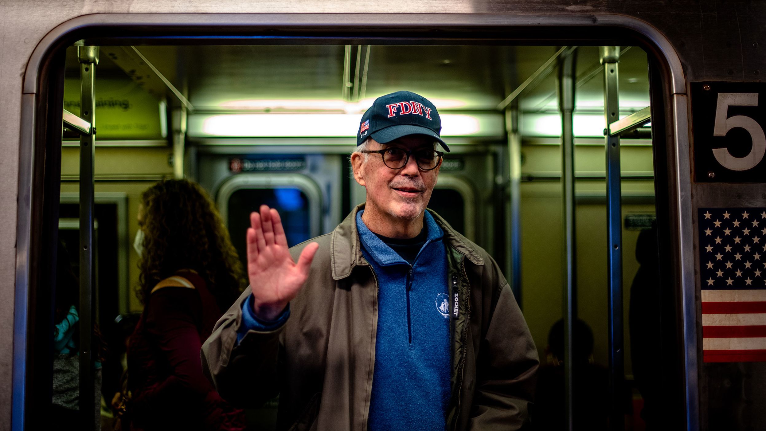 Patrick Curley inside a train at a Times Square-42 Street subway platform.