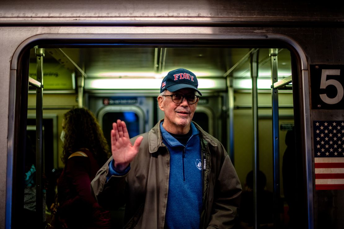 Patrick Curley inside a train at a Times Square-42 Street subway platform.