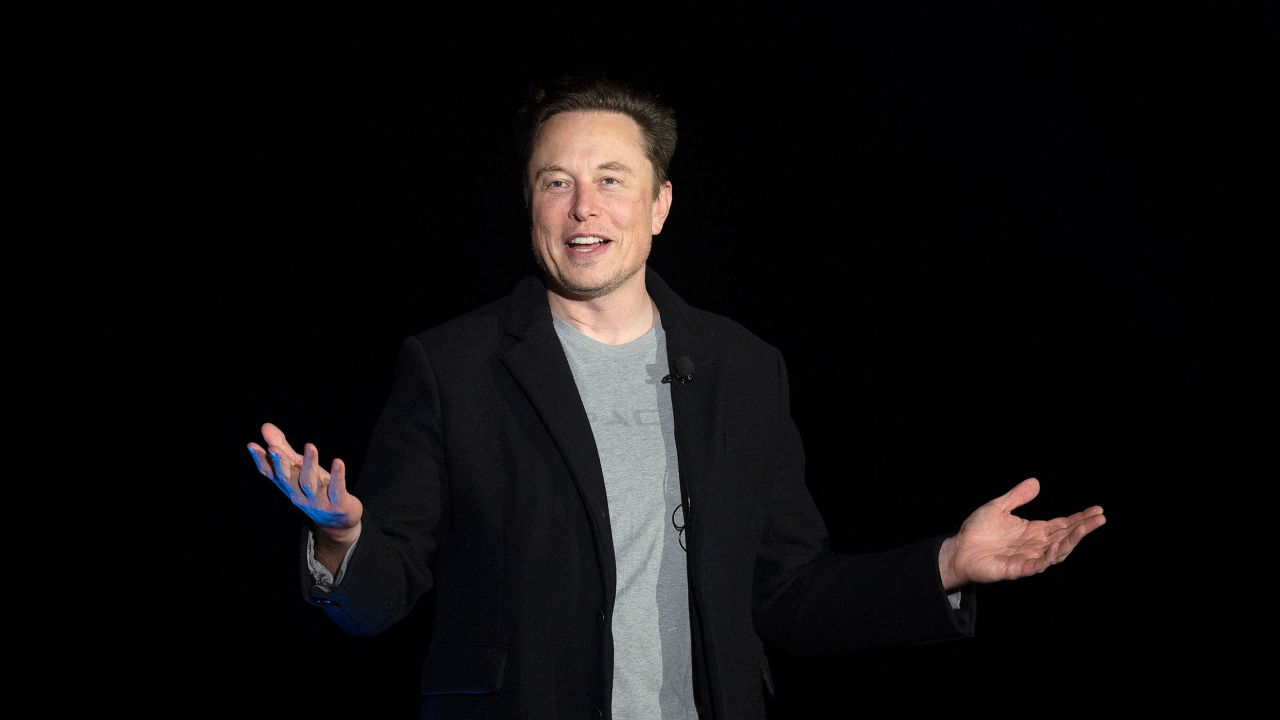 Elon Musk gestures as he speaks during a press conference at SpaceX's Starbase facility near Boca Chica Village in South Texas on February 10, 2022. Billionaire entrepreneur Elon Musk delivered an eagerly-awaited update on SpaceX's Starship, a prototype rocket the company is developing for crewed interplanetary exploration.