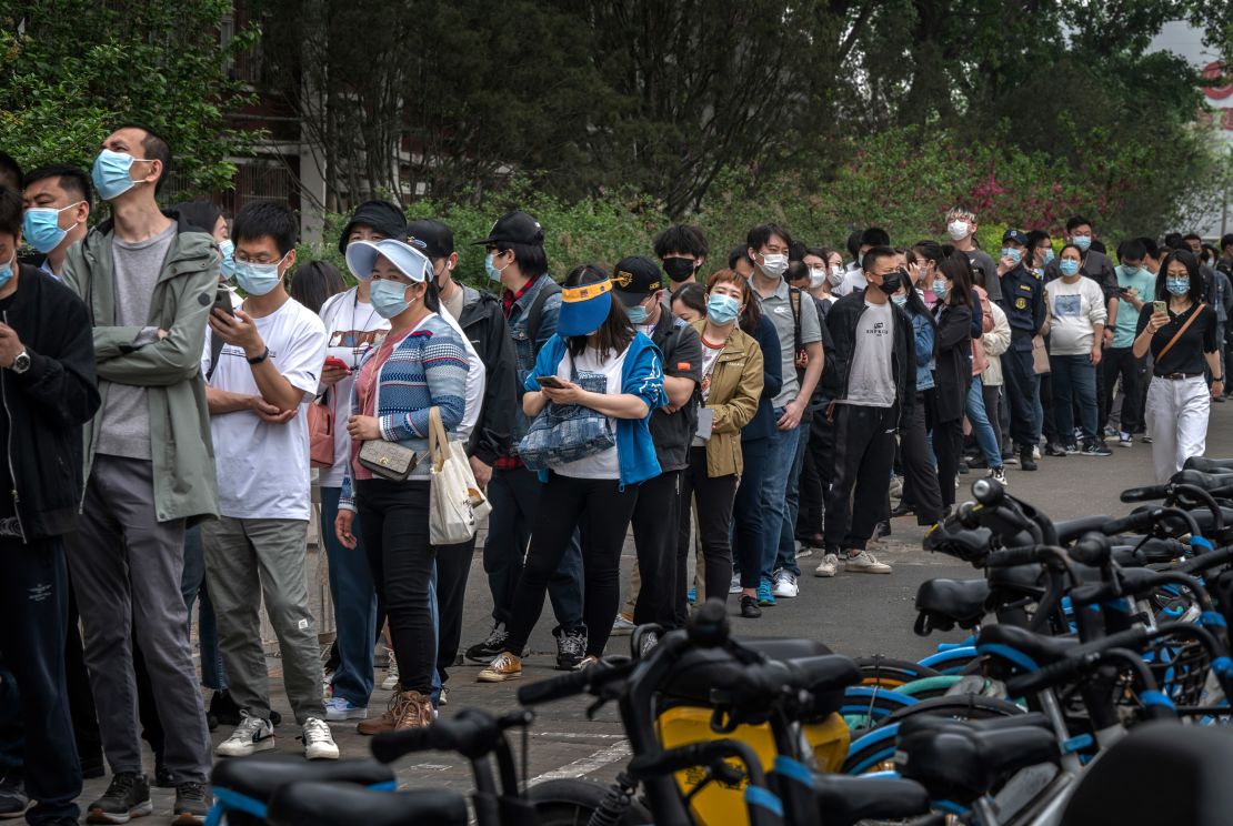 People line up for Covid tests at a makeshift testing site in Beijing's Chaoyang district on Monday.