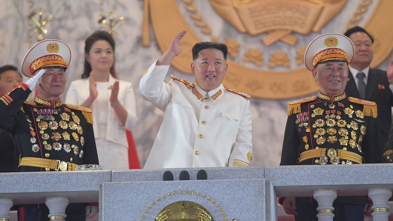 This picture taken on Monday and released from North Korea's official Korean Central News Agency on Tuesday shows North Korean leader Kim Jong Un, center, attending a grand military parade in Pyongyang.