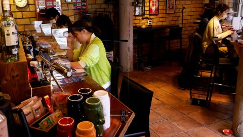 Customers work on their manuscripts at the Manuscript Writing Cafe in Tokyo, Japan, on April 21, 2022.