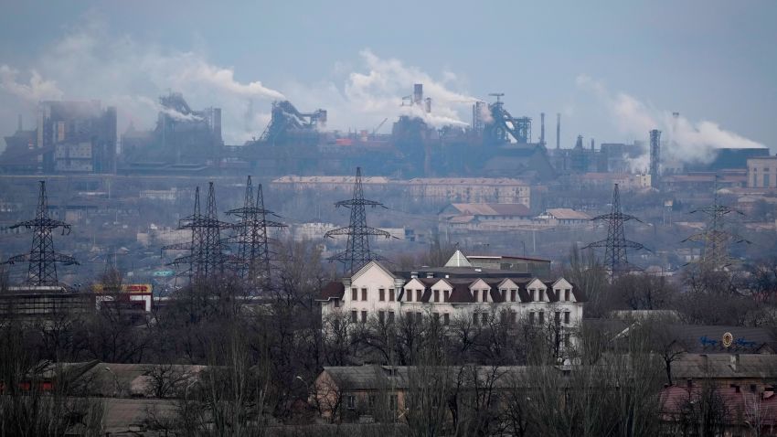 FILE - A metallurgical plant is seen on the outskirts of the city of Mariupol, Ukraine, Thursday, Feb. 24, 2022. Russia began evacuating its embassy in Kyiv, and Ukraine urged its citizens to leave Russia. Russian President Vladimir Putin ordered his forces not to storm the last remaining Ukrainian stronghold in the besieged city of Mariupol but to block it "so that not even a fly comes through." Defense Minister Sergei Shoigu told Putin on Thursday that the sprawling Azovstal steel plant where Ukrainian forces were holed up was "securely blocked." (AP Photo/Sergei Grits, File)