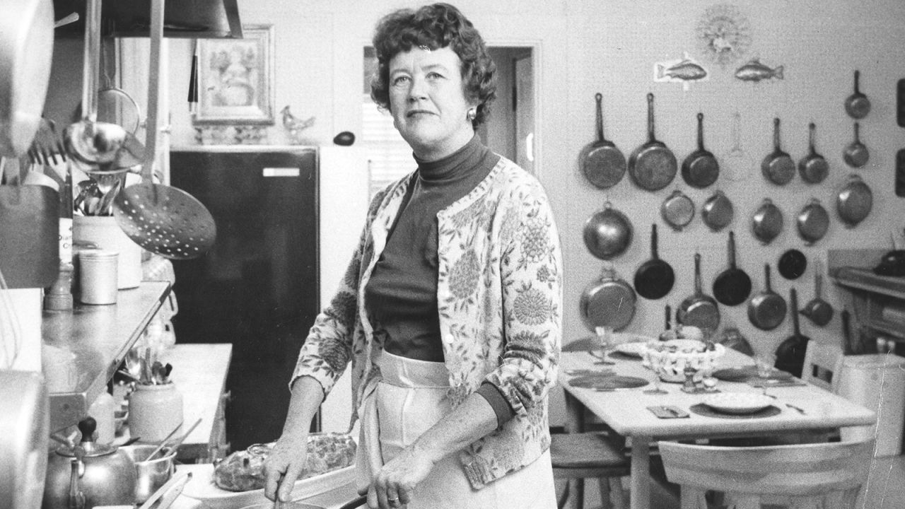 Chef and cookbook author Julia Child poses in her kitchen in Boston in 1964.