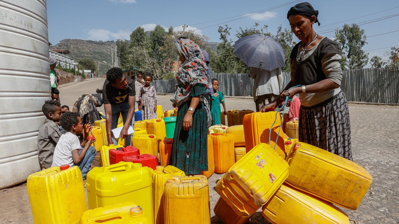 Civilians fill plastic containers with water in Lalibela, a town in northern Ethiopia, on March 31, 2022.