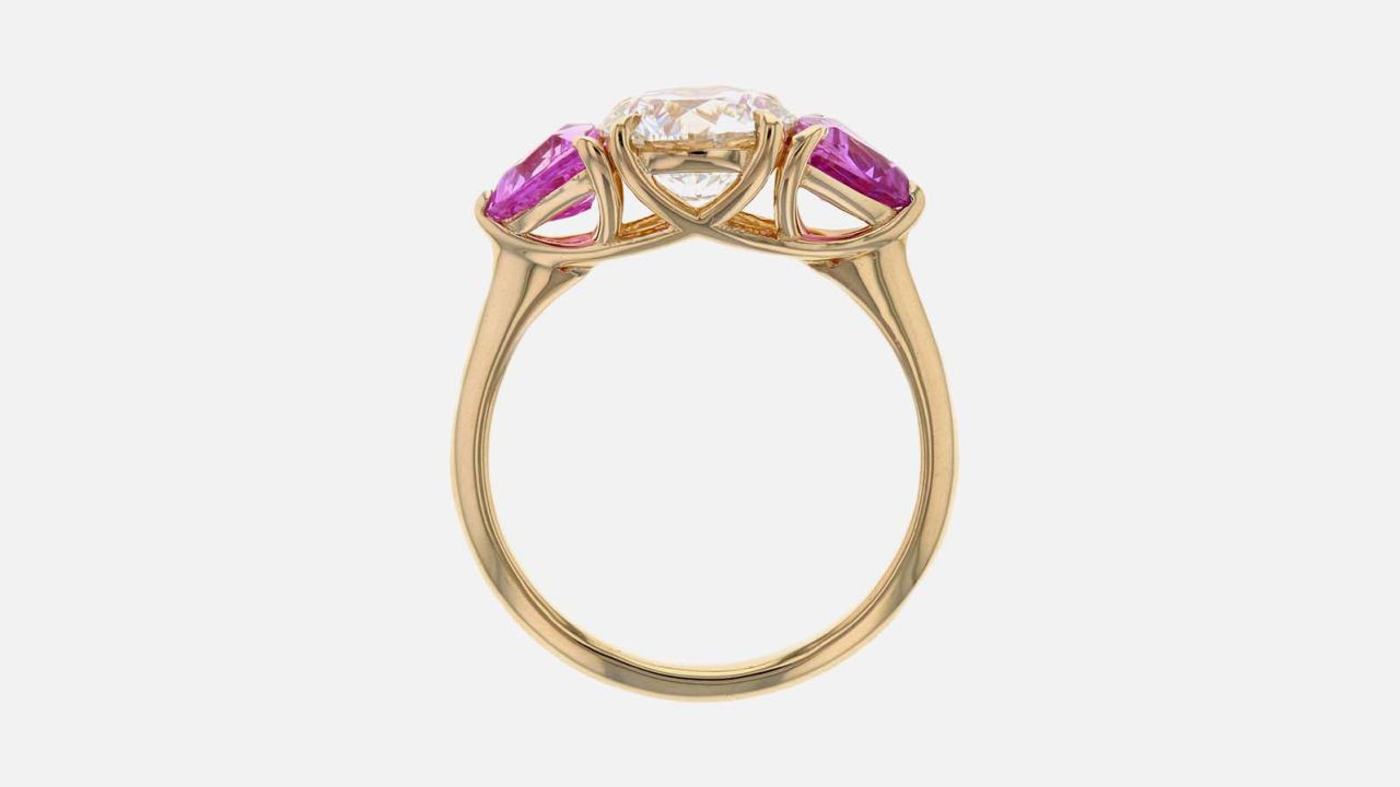 This engagement ring from Concierge diamonds has a 1ct  lab grown diamond with 2 pink sapphires in a14K yellow gold band. (Prices start at $3,500 depending on the center diamond)