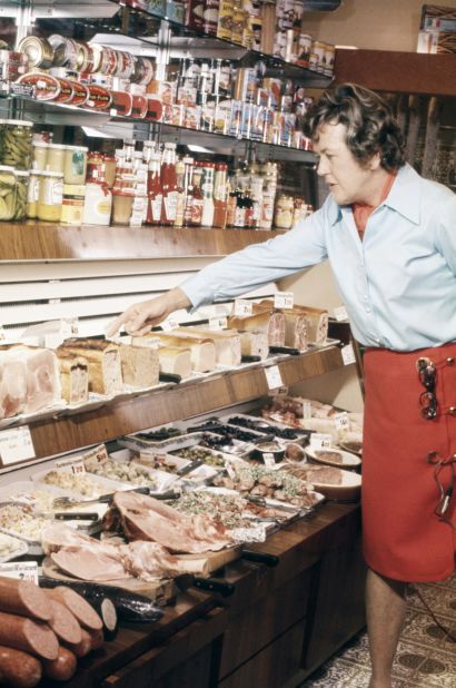 Child selects items at a charcuterie shop in the late 1970s.