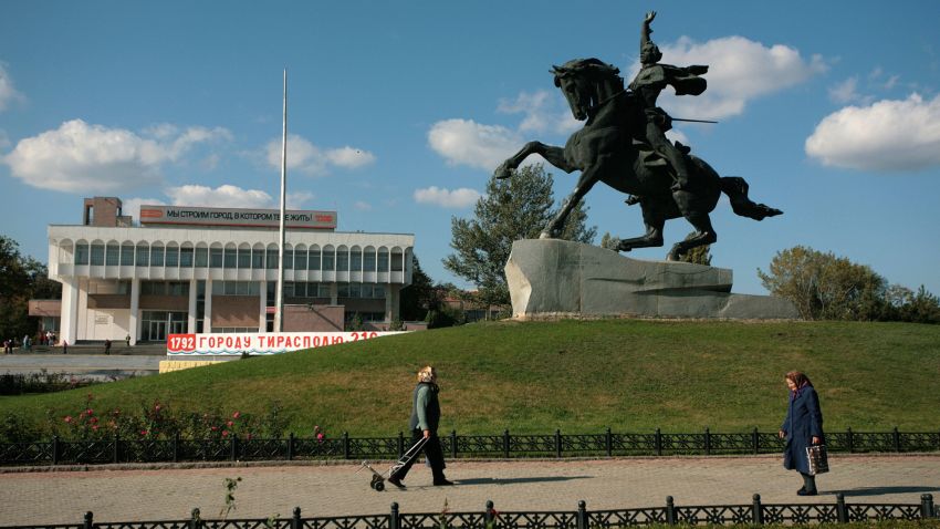 TIRASPOL, MOLDOVA - OCTOBER 19: Woman pass October 19, 2008 the statue of Alexander Suvorov the founder of Tiraspol in the Transnistria region in Moldova. Tiraspol is the second largest city in Moldova and is the capital and administrative centre of the de facto independent Pridnestrovian Moldavian Republic (Transnistria). The city is located on the eastern bank of the Dniester River. Tiraspol is a regional hub of light industry, such as furniture and electrical goods production. There are two professional football clubs in Tiraspol: FC Sheriff Tiraspol & FC Tiraspol. Sheriff are the most successful Moldovan football club of recent history. Tiraspol is home to the Sheriff Stadium, the biggest seated stadium in the region with a capacity of 14,300. The Trans-Dnistrian Moldavian Republic, locatet in the eastern region of the country, is internationally not acknowledged but does have ist own president, currency and army. Transnistria - an internationally unrecognized state  is part of Moldavia. The region has been de facto idependent since 1991, after making a unilateral declaration of indepenence from Moldova and successfully defeated Moldavian forces in the war of Transnistria. Since than a ceasefire has held but Transnistria - where the most of the Moldavian Industry is located - is still a "frozen conflict" region. (Photo by Matthias Schumann/Getty Images)