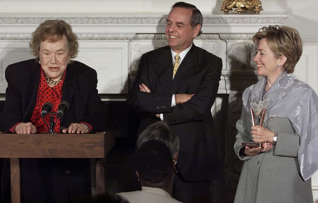 Child speaks as first lady Hillary Clinton and Sara Lee Chairman and CEO John Bryan look on at the White House in 1999. Child was selected as a recipient of Sara Lee's Frontrunner Award, which recognizes women  daring to be first in the arts, business, government and the humanities. 