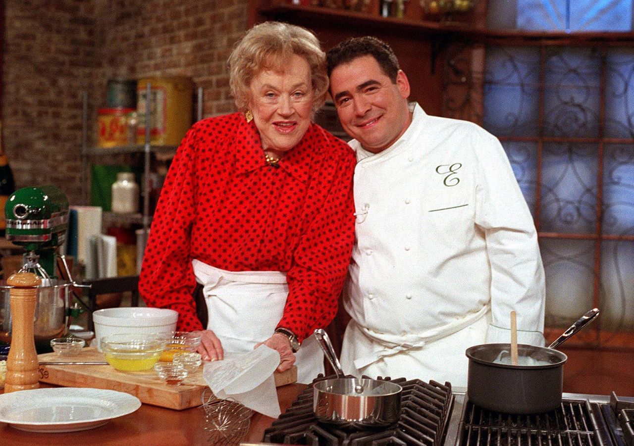 Child joins chef Emeril Lagasse on the set of Lagasse's show in New York in 2000. Child inspired a generation of chefs who followed in her footsteps.