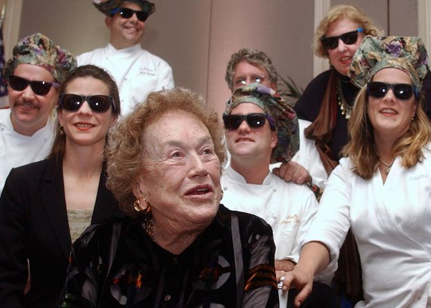 Boston-area chefs wearing sunglasses and funny hats join Child at a farewell dinner in Cambridge, Massachussets, in 2001. Child soon moved back to her native California.