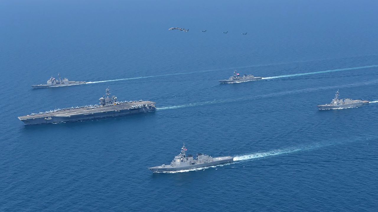 USS Abraham Lincoln, left, and JS Kongo, front, take part in a US-Japan joint exercise in the Sea of Japan on April 12