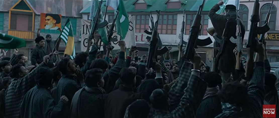 A scene from the film shows Islamic militants waving weapons in the air.