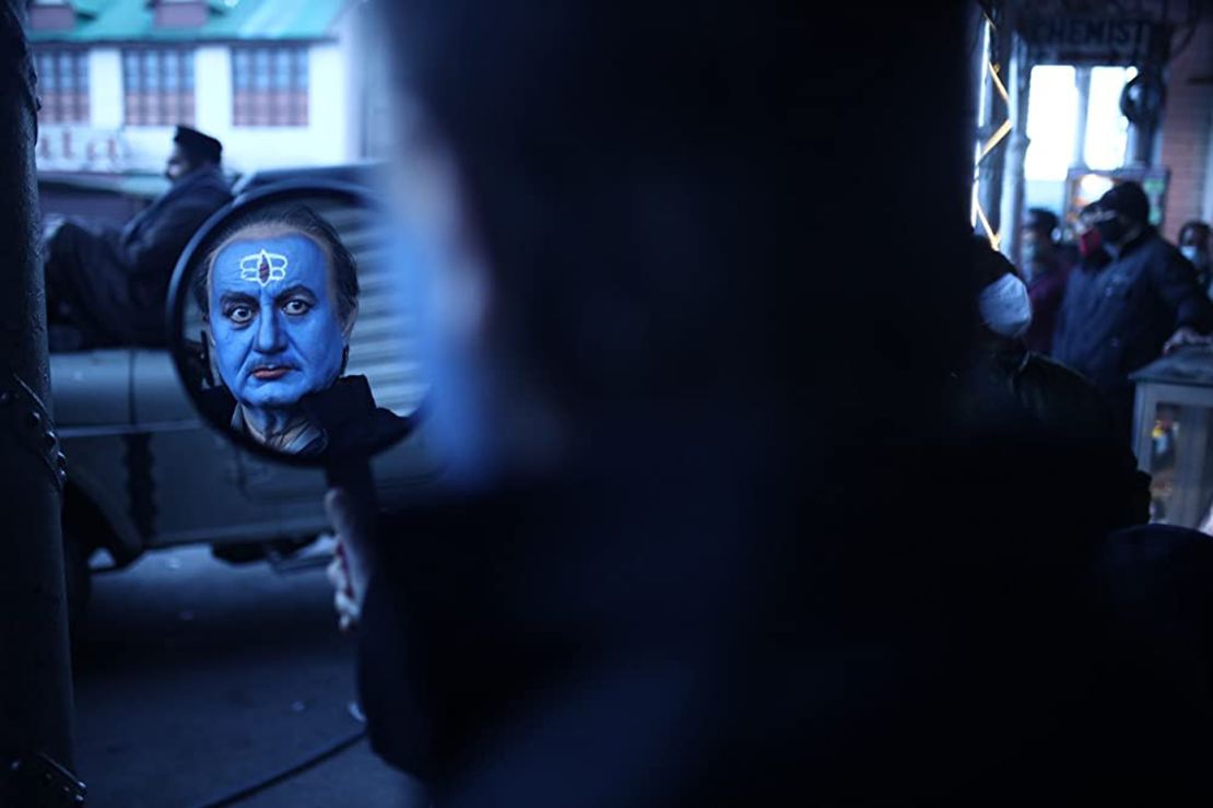Indian actor Anupam Kher portrays the Kashmiri Pandit grandfather in the "The Kashmir Files." For a scene in the film, his face was painted blue, symbolic of Hindu deities.