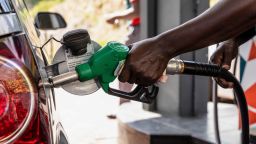A worker refuels a vehicle at a Caltex gas station, operated by Chevron Corp., in Cape Town, South Africa, on Wednesday, March 23, 2022. 