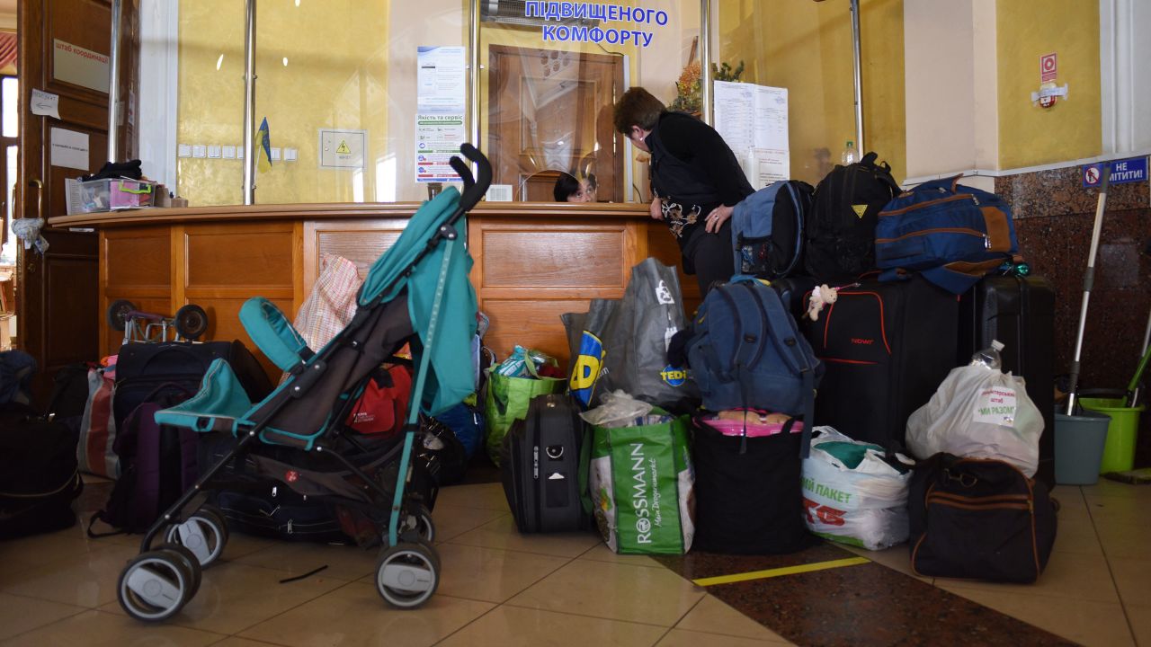 Baby strollers, diapers and formula line the entryway of the room for women and children above Lviv station.