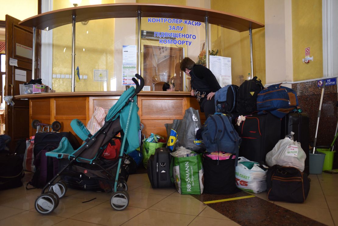 Baby strollers, diapers and formula line the entryway of the room for women and children above Lviv station.
