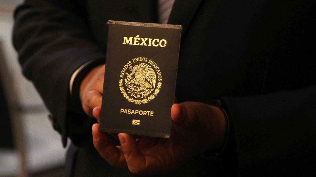 A new type of electronic passport that has a chip and a polycarbonate sheet is shown in 2021.