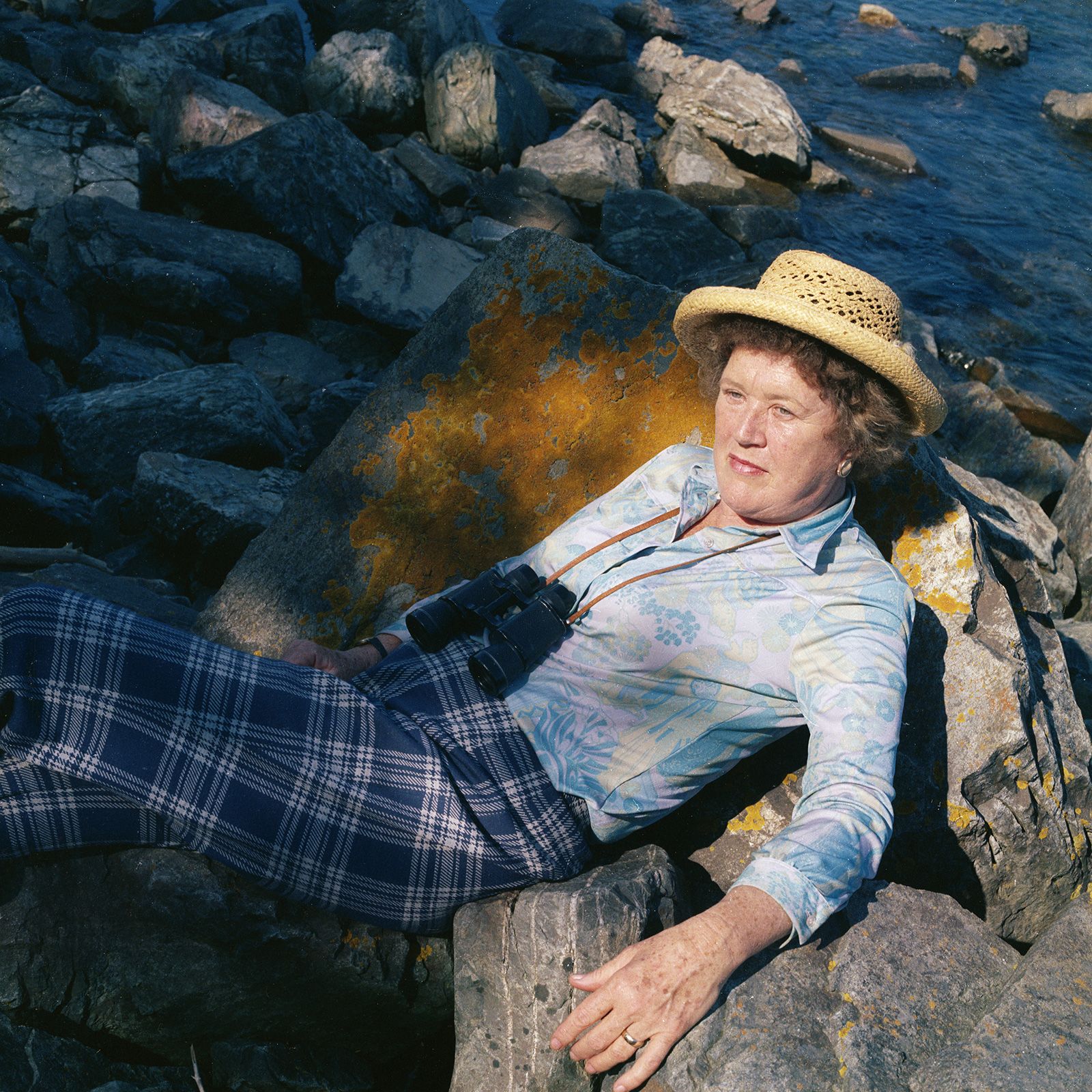 Child poses for a portrait by the ocean in 1973.