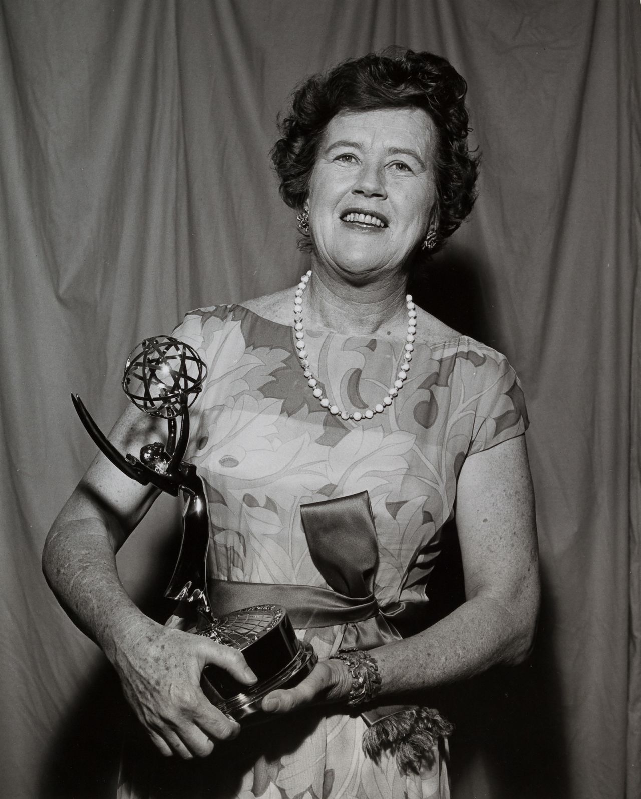 Child poses with an Emmy Award she won for "The French Chef" in 1966. Child was the first educational television personality to win an Emmy Award.