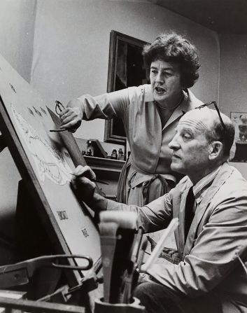 Child and her husband, Paul, review set drawings in 1964.
