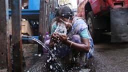 A old age women puts water on his face to get relief from extreme heat during hot weather,  Maximum Temperature In Kolkata Likely To Touch 40 Degrees on April 26,2022.The India Meteorological Department (IMD) Monday issued a heatwave warning over several districts of West Bengal from April 25 to April 28 and asked the residents of the state to avoid prolonged heat exposure. (Photo by Debajyoti Chakraborty/NurPhoto via Getty Images)