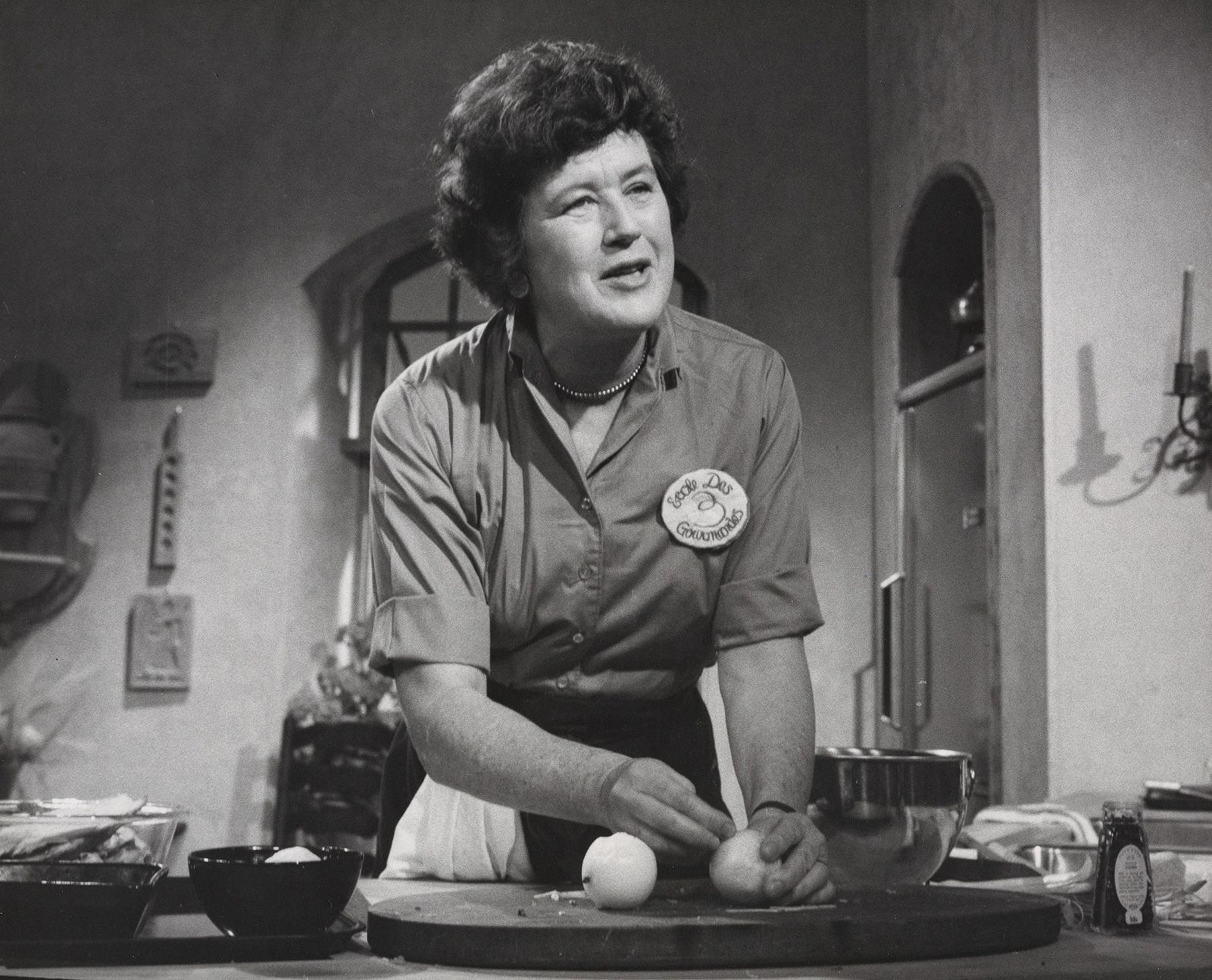 Child holds onions while filming an episode of "The French Chef" in 1964.