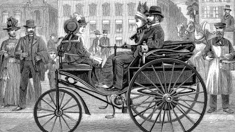 Bertha Benz drove around in her husband Karl's creation, the Benz Patent Motorwagen, taking order from curious onlookers. (This print shows a slightly later model of the Patent Motorwagen being driven by a man.)