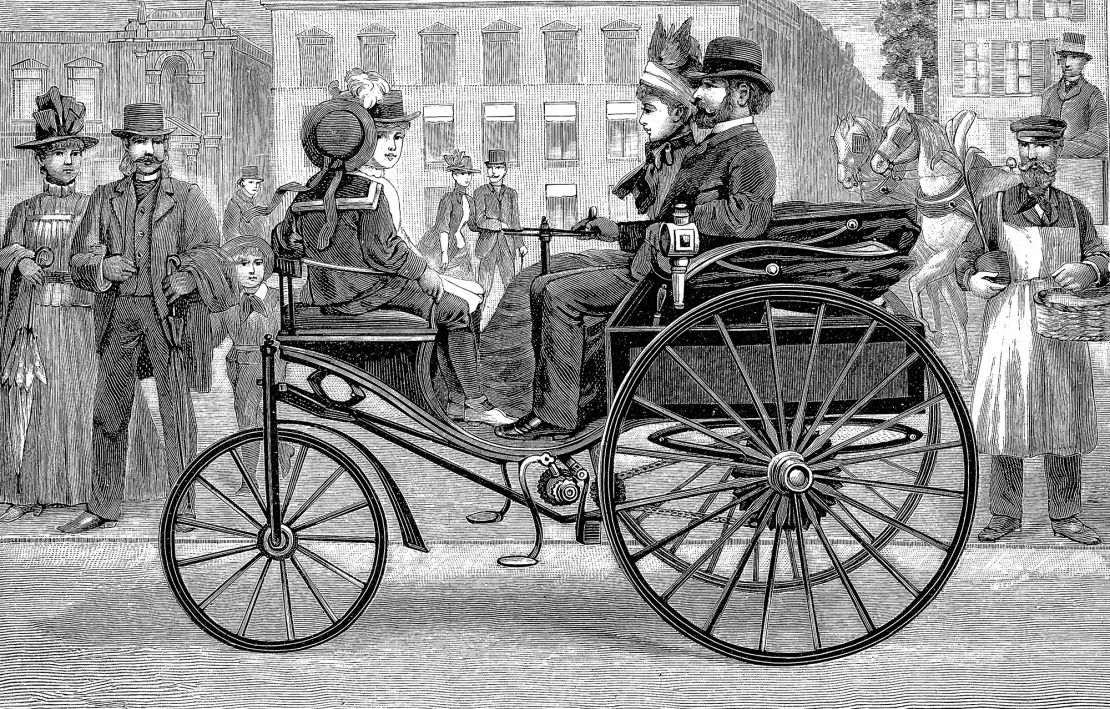 Bertha Benz drove around in her husband Karl's creation, the Benz Patent Motorwagen, taking order from curious onlookers. (This print shows a slightly later model of the Patent Motorwagen being driven by a man.)