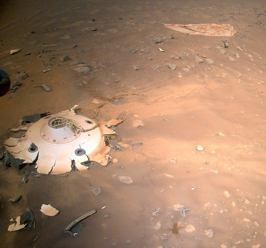 The backshell and its debris field can be seen from Ingenuity's position above the landing site.