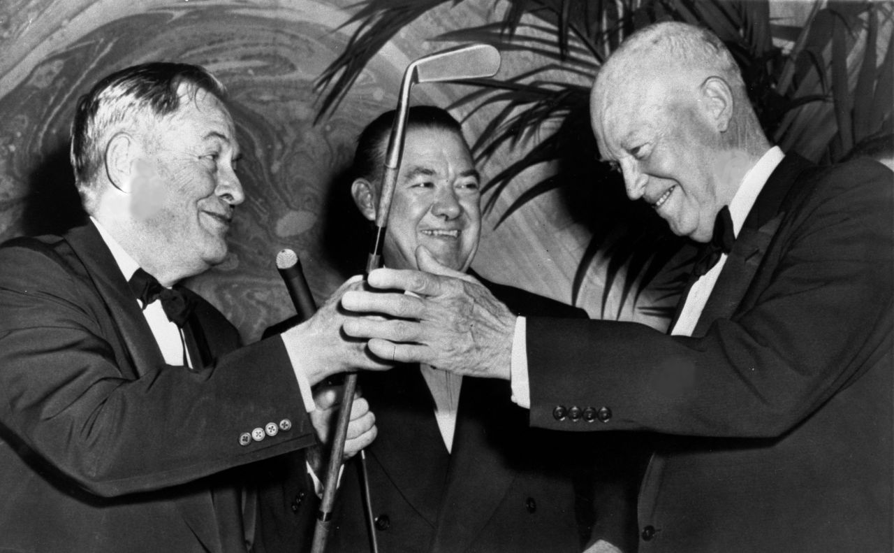 Legendary golfer Bobby Jones, left, presents a duplicate of his famous putter, Calamity Jane, to President Dwight D. Eisenhower at the dinner in 1959. In the center is Felix Belair Jr. of The New York Times.