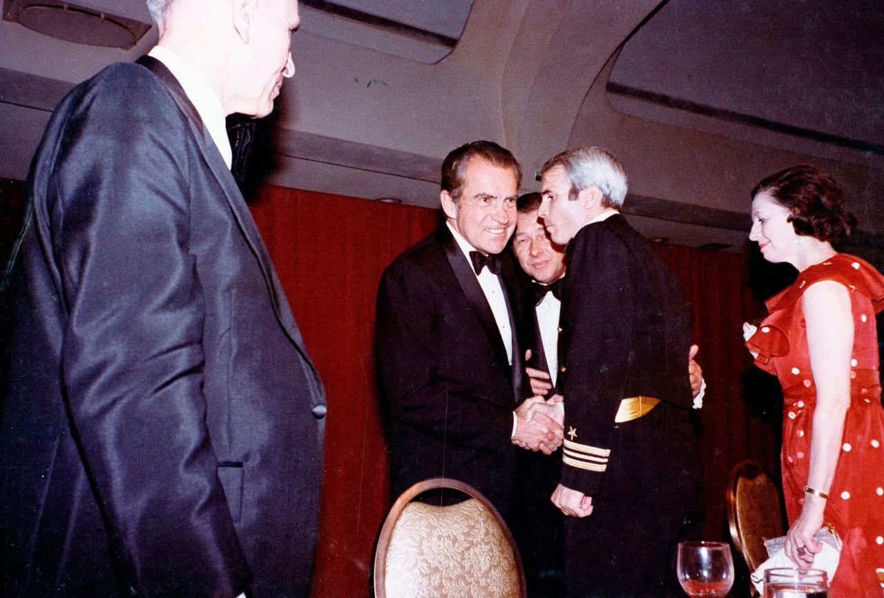 President Richard Nixon shakes hands with US Navy Lt. Cmdr. John McCain at the dinner in 1973. Just a month earlier, McCain had been released from a Vietnamese prison after being a prisoner of war for over five years.