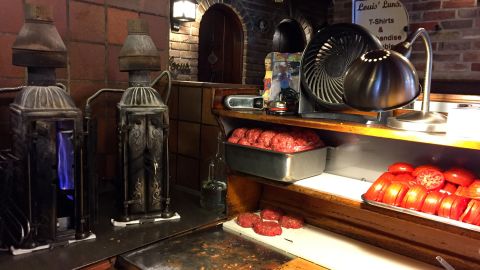 Hamburgers waiting to be cooked in antique, upright cast-iron broiler stoves at Louis' Lunch, a longtime eatery in New Haven, Connecticut.