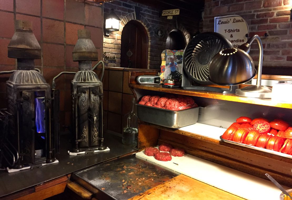 Hamburgers waiting to be cooked in antique, upright cast-iron broiler stoves at Louis' Lunch, a longtime eatery in New Haven, Connecticut.